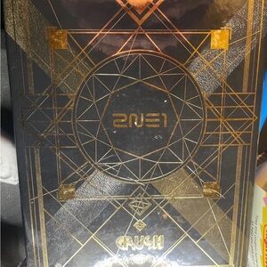 2NE1 Crush Album with Geometric Gold Design